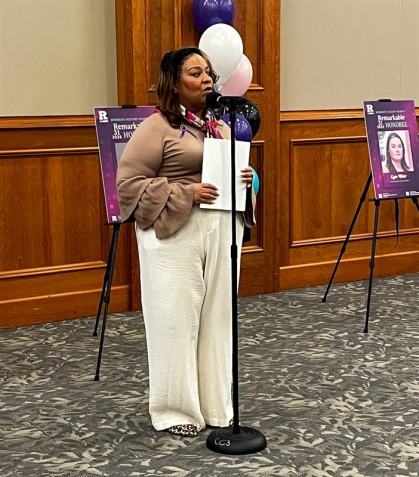 TiAria Neil speaks to those gathered to celebrate.